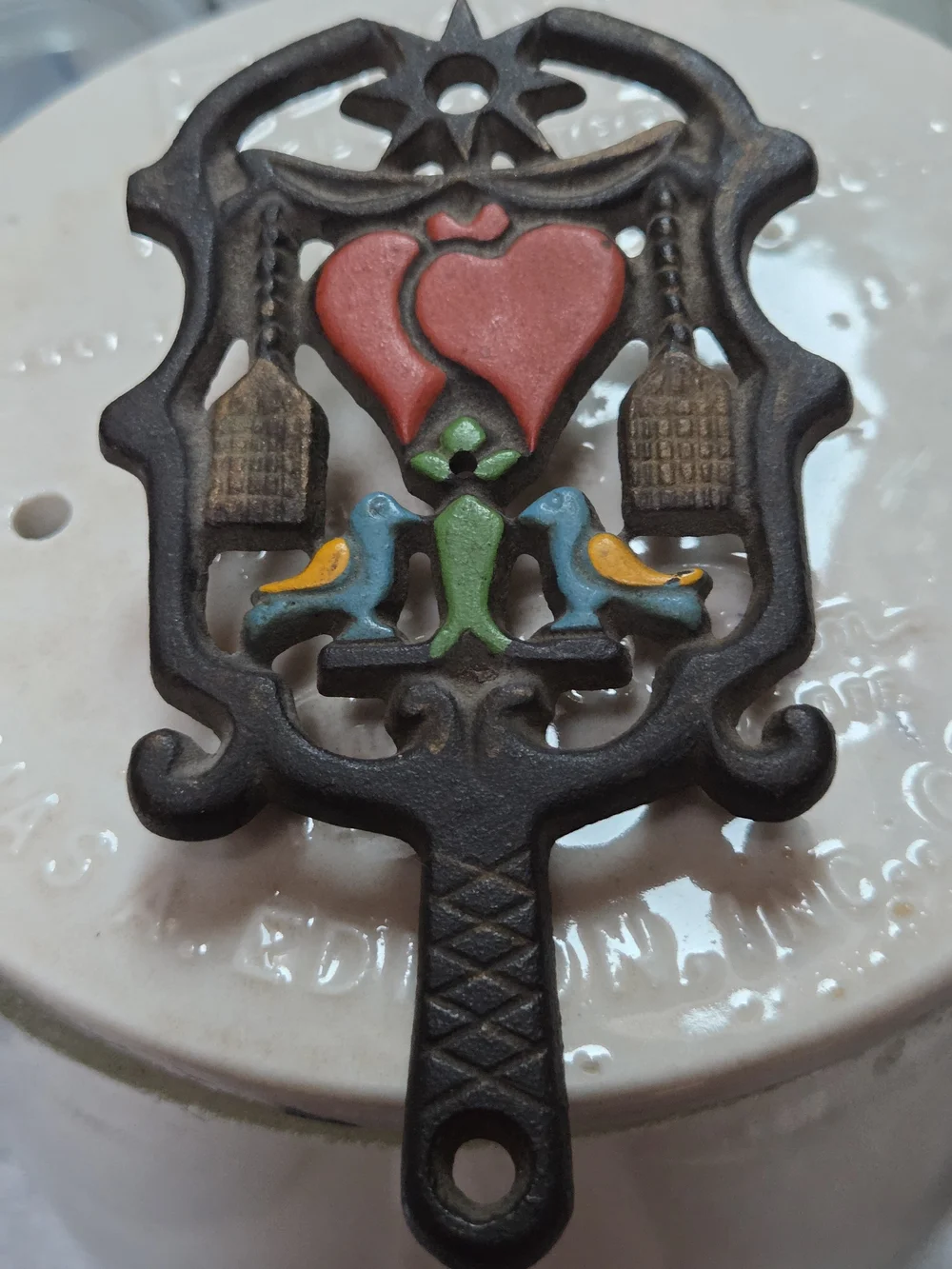 Vintage Wilton Black Cast Iron Small Trivet w/ Painted Brooms, Hearts & Birds